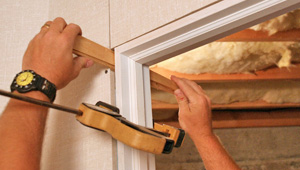 Installing trim and finishing touches to a remodeled basement in Port Orchard, WA