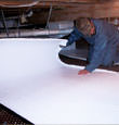 Aberdeen insulation being installed in a crawl space.