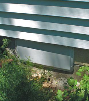 A gray crawl space vent cover in Hoquiam
