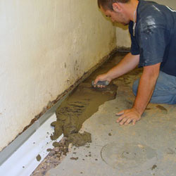 Testing a French drain system in a Belfair home.