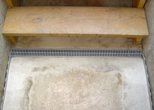Our grated drain system installed on a leaking basement staircase in Allyn.