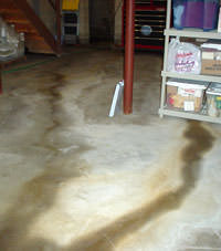 Flooding entering a basement through a floor crack in Ocean Shores