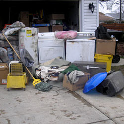 Soaked, wet personal items sitting in a driveway, including a washer and dryer in Aberdeen.