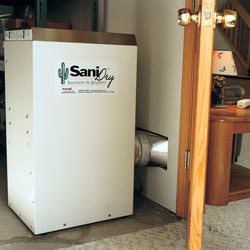 A basement dehumidifier with an ENERGY STAR® rating ducting dry air into a finished area of the basement  in Port Hadlock