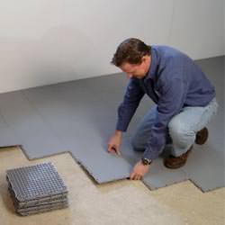 basement subfloor tiles being installed by a contractor in Onalaska