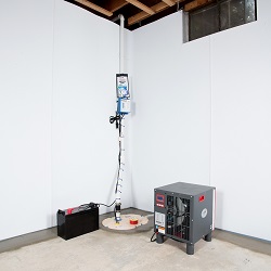 Sump pump system, dehumidifier, and basement wall panels installed during a sump pump installation in Kingston